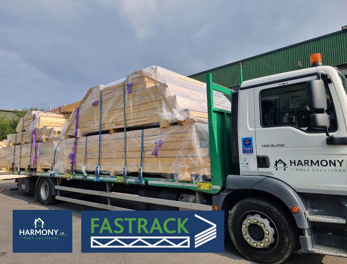 Flatbed lorry with wood on the back