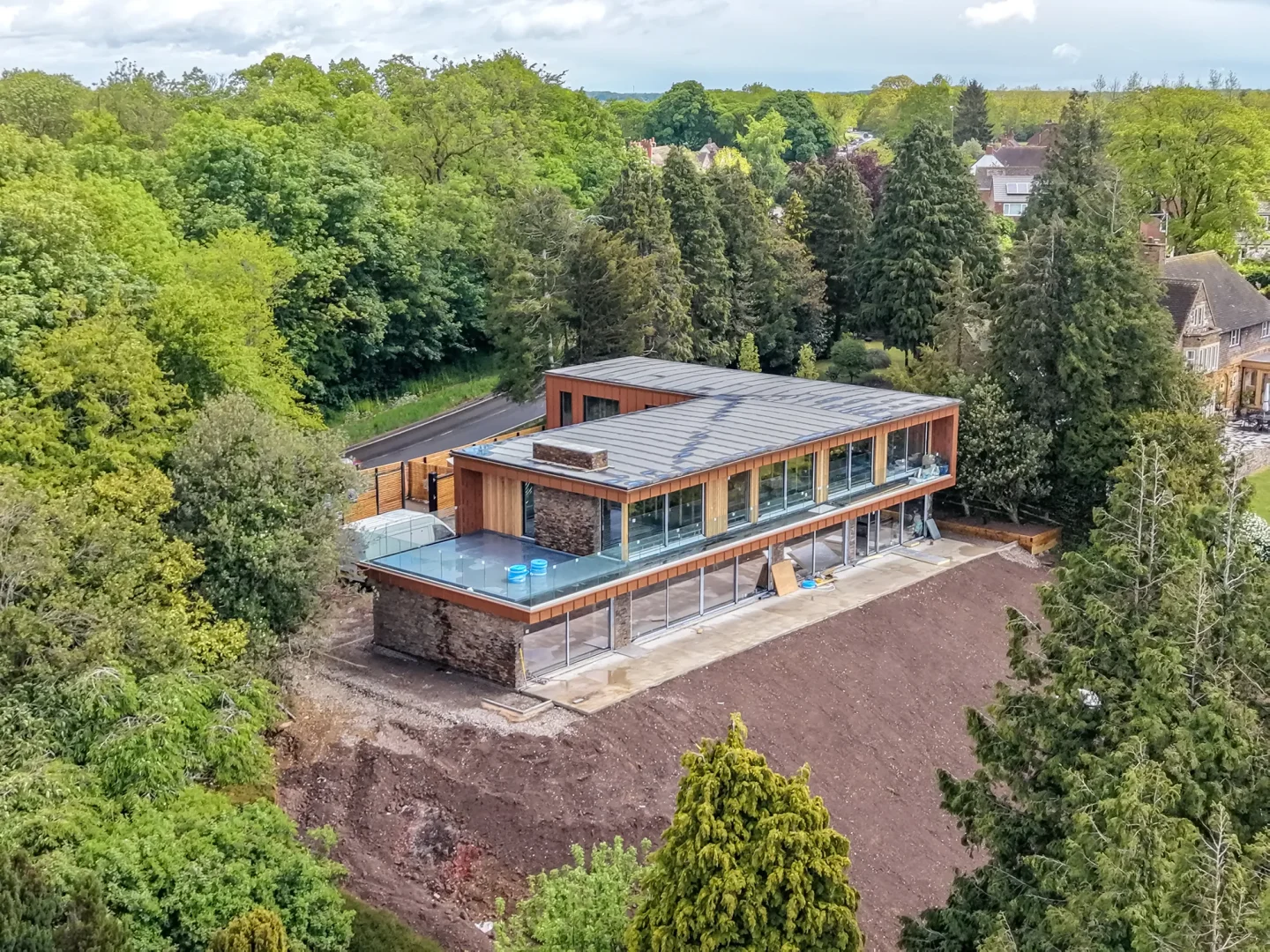 Modern house nestled into trees