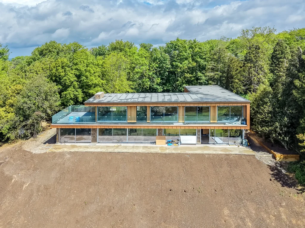 Modern house nestled into trees