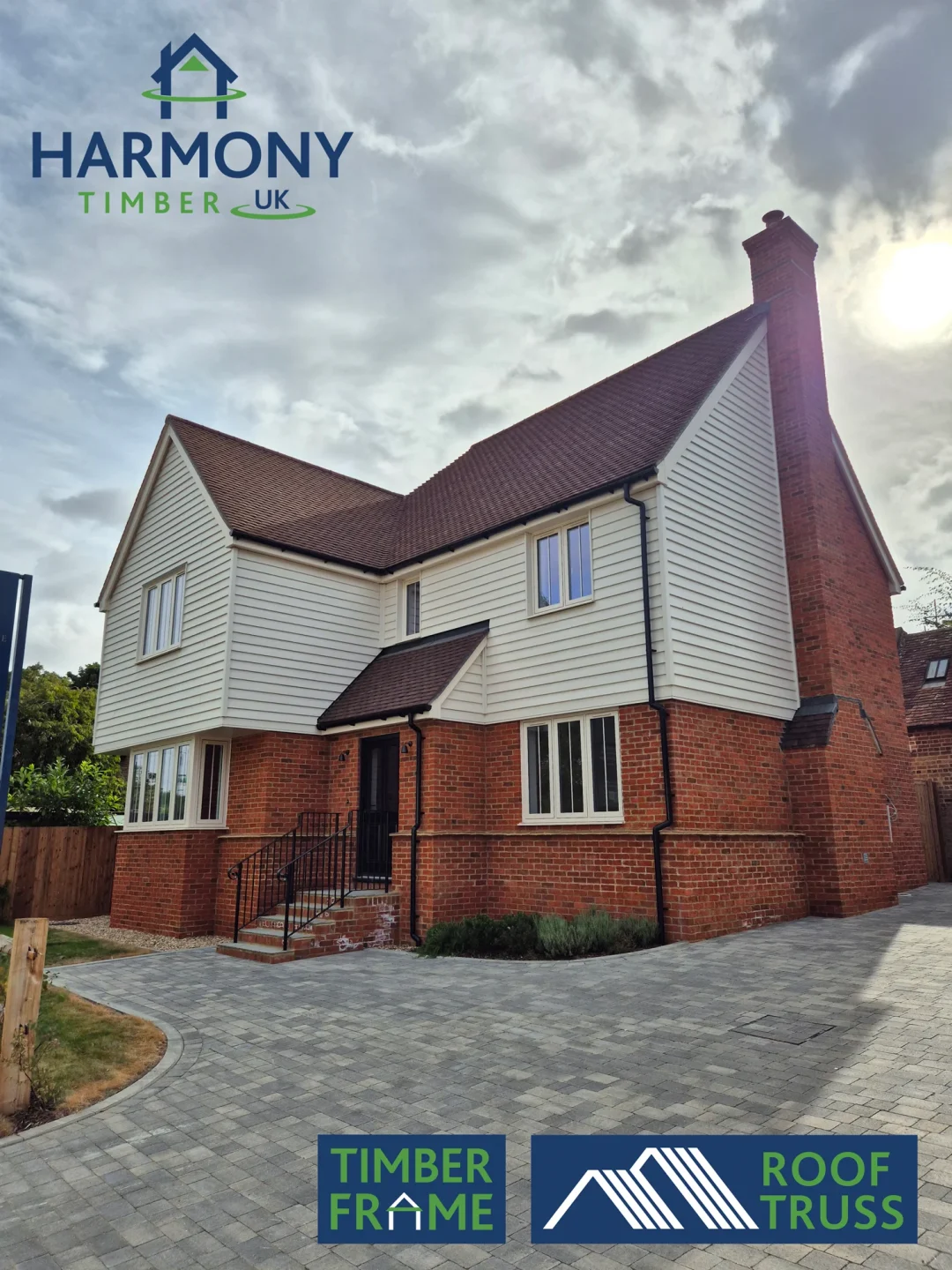 A brick house with the harmony logo at the top of the picture and a Roof Truss and Timber frame logo in the bottom right.